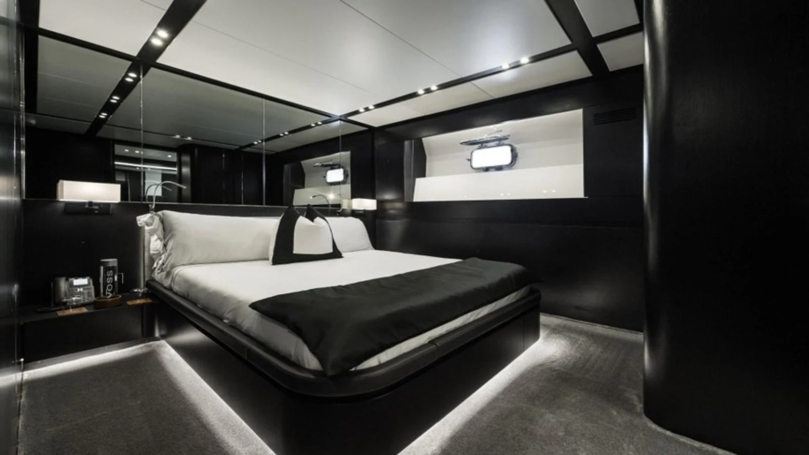 A luxurious stateroom featuring a sleek, modern design with ambient lighting. aboard R23 Yacht for Sale