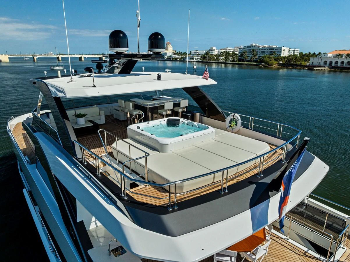 The yacht features a luxurious sundeck with a spacious hot tub and ample lounging areas, perfect for relaxation and entertainment. aboard SERENITY NOW Yacht for Sale