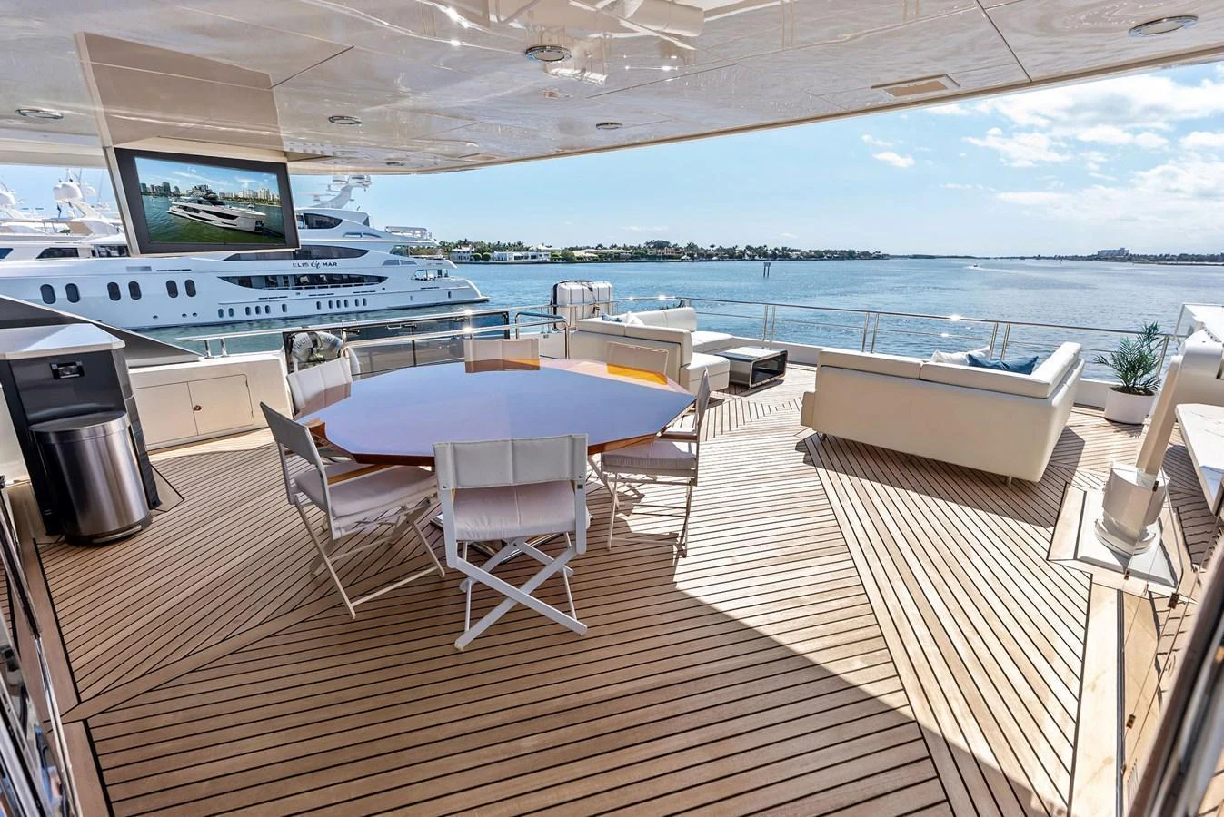The aft deck offers a spacious and luxurious outdoor dining and lounging area with stunning sea views. aboard SERENITY NOW Yacht for Sale
