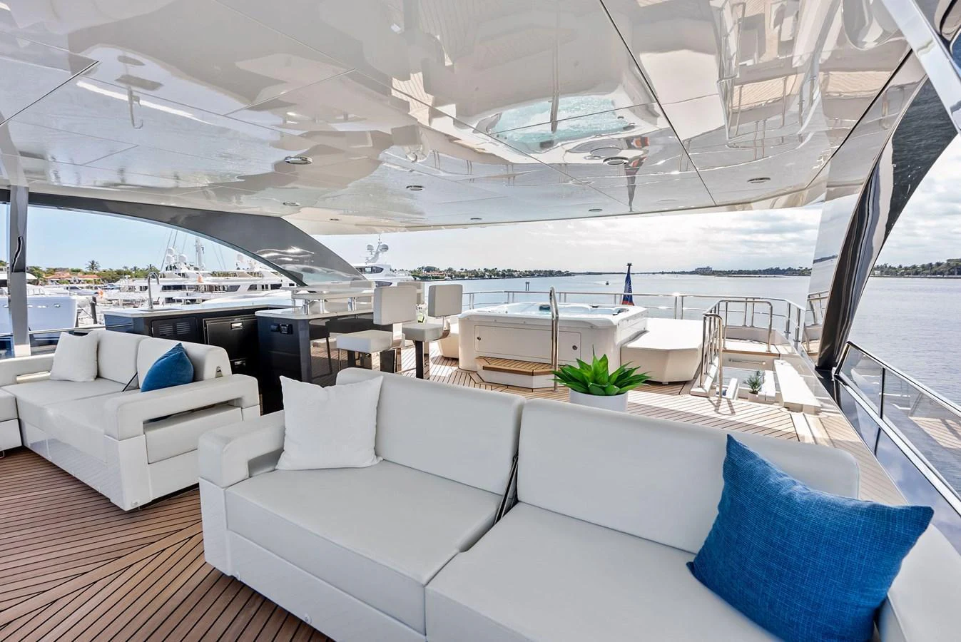 The aft deck features luxurious seating and a stunning view of the water. aboard SERENITY NOW Yacht for Sale