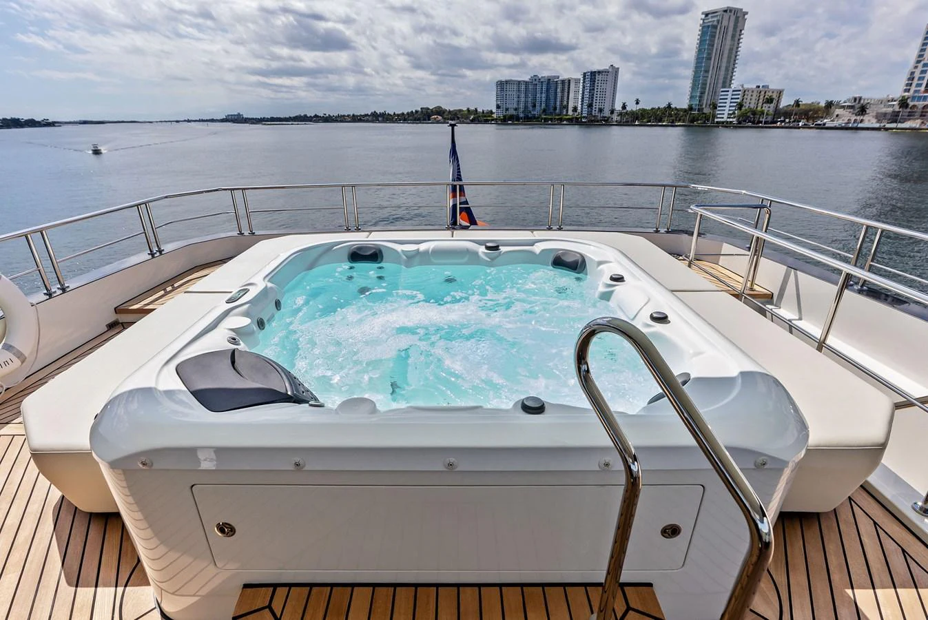 The sundeck features a luxurious jacuzzi with stunning views of the water. aboard SERENITY NOW Yacht for Sale