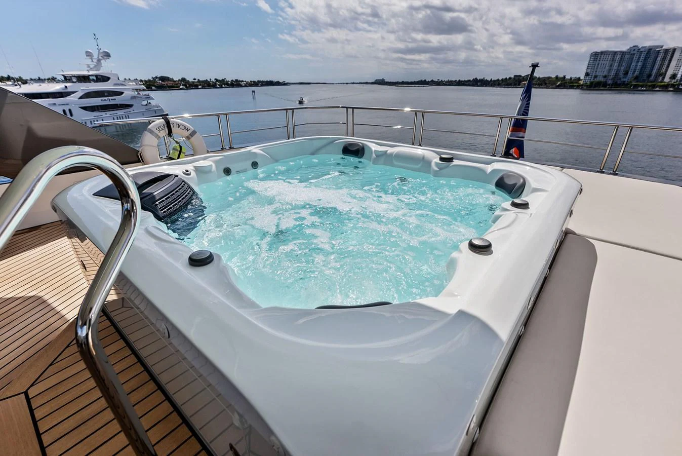 The yacht features a luxurious jacuzzi on the deck, offering stunning views of the surrounding waters. aboard SERENITY NOW Yacht for Sale