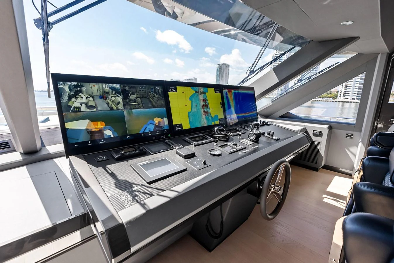 The helm station features advanced navigation equipment and a sleek, modern design. aboard SERENITY NOW Yacht for Sale