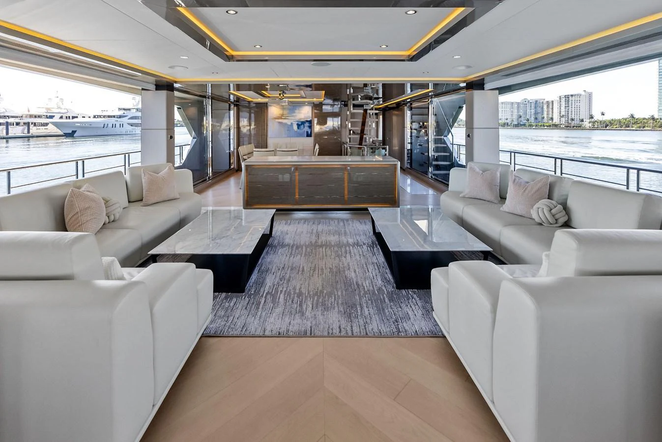 The yacht's salon features luxurious seating with a modern, open design and panoramic views. aboard SERENITY NOW Yacht for Sale