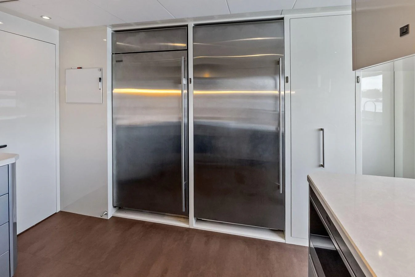 The galley features sleek stainless steel appliances and modern cabinetry. aboard SERENITY NOW Yacht for Sale