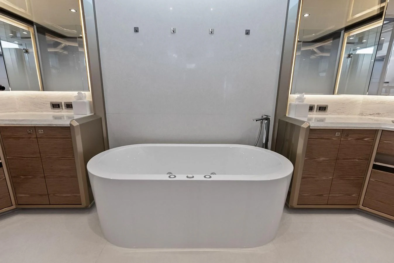 A luxurious bathroom with a sleek freestanding bathtub and modern fixtures. aboard SERENITY NOW Yacht for Sale