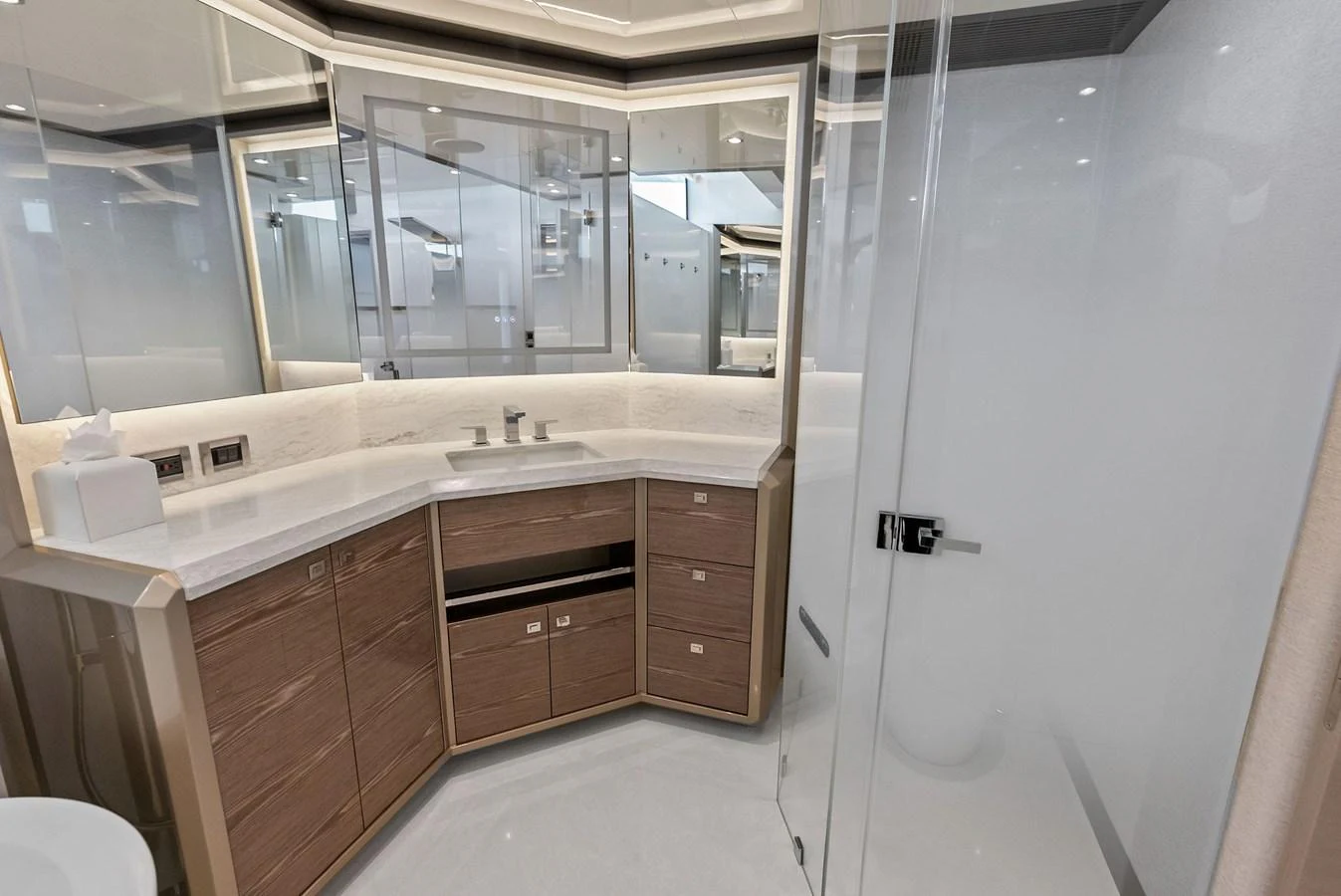 The yacht's bathroom features modern fixtures and ample storage with a sleek, contemporary design. aboard SERENITY NOW Yacht for Sale