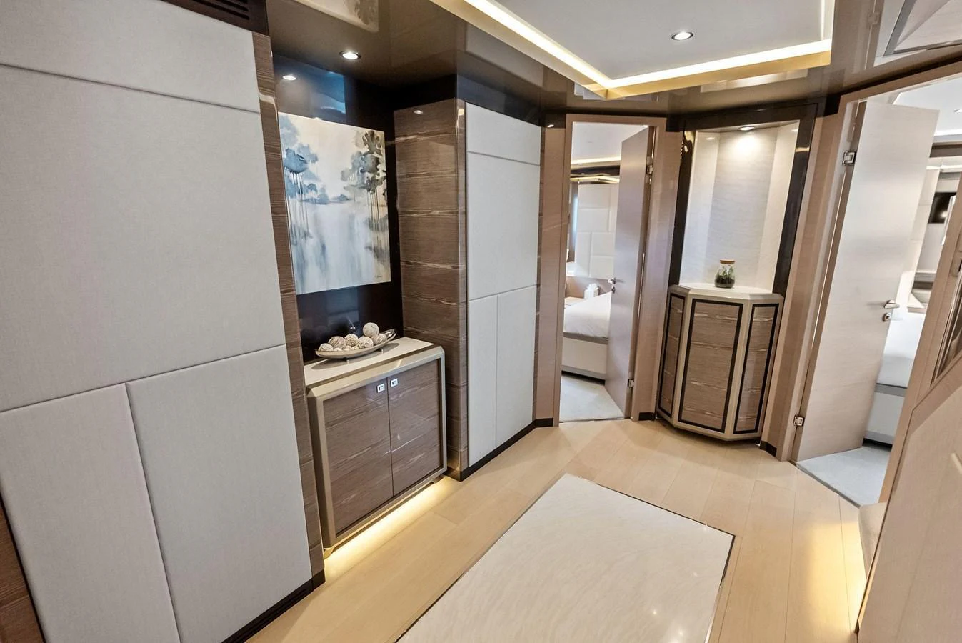 A luxurious hallway with modern decor and elegant lighting. aboard SERENITY NOW Yacht for Sale