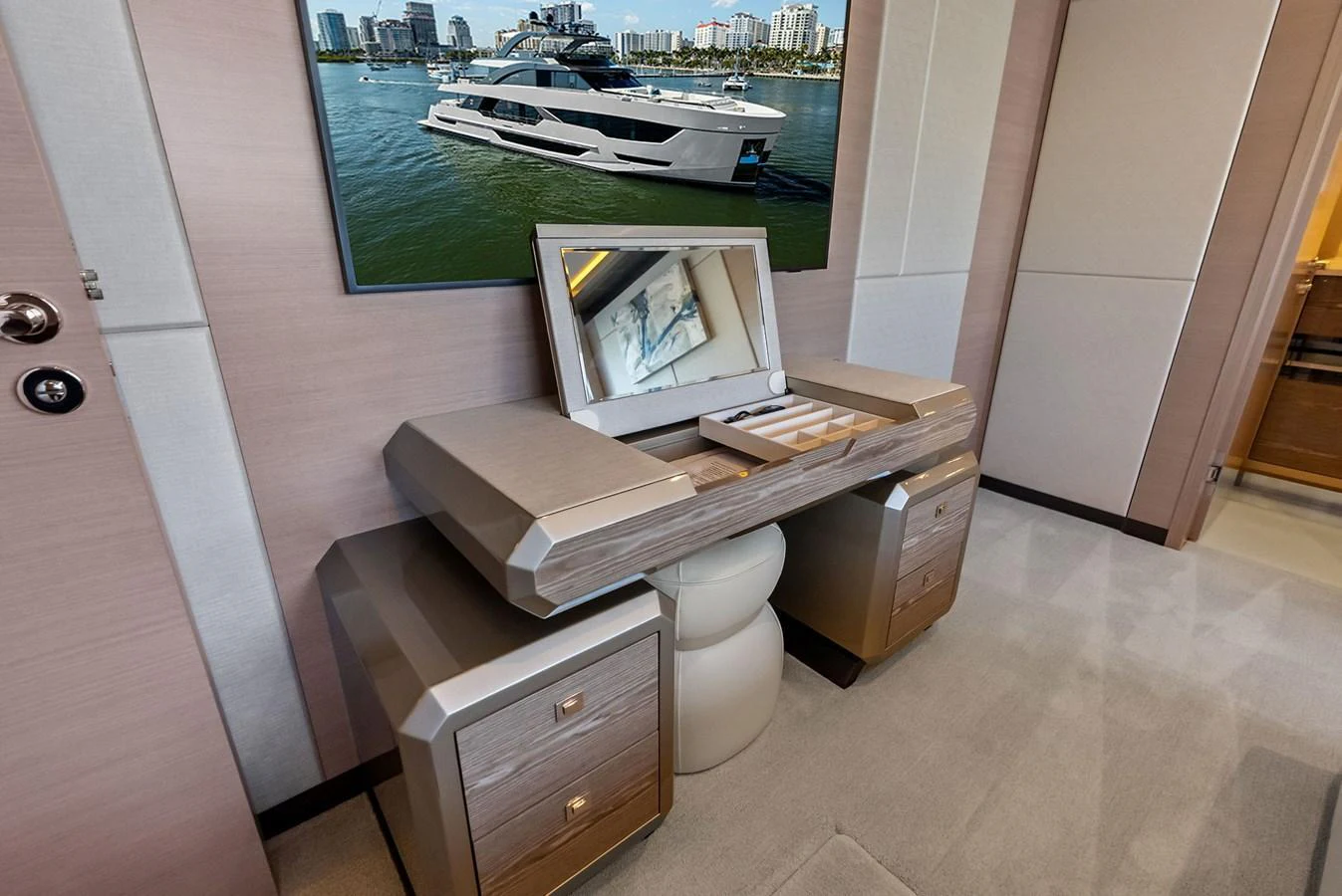 A luxurious vanity area with a mirror and storage drawers, set within an elegant yacht interior. aboard SERENITY NOW Yacht for Sale
