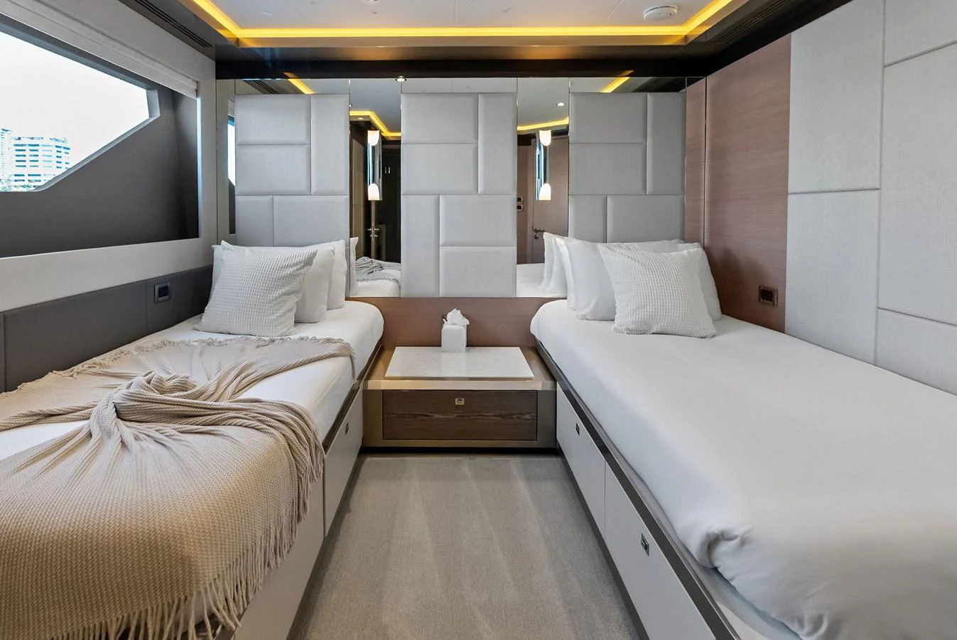 The guest stateroom features two single beds with modern decor and ample natural light. aboard SERENITY NOW Yacht for Sale