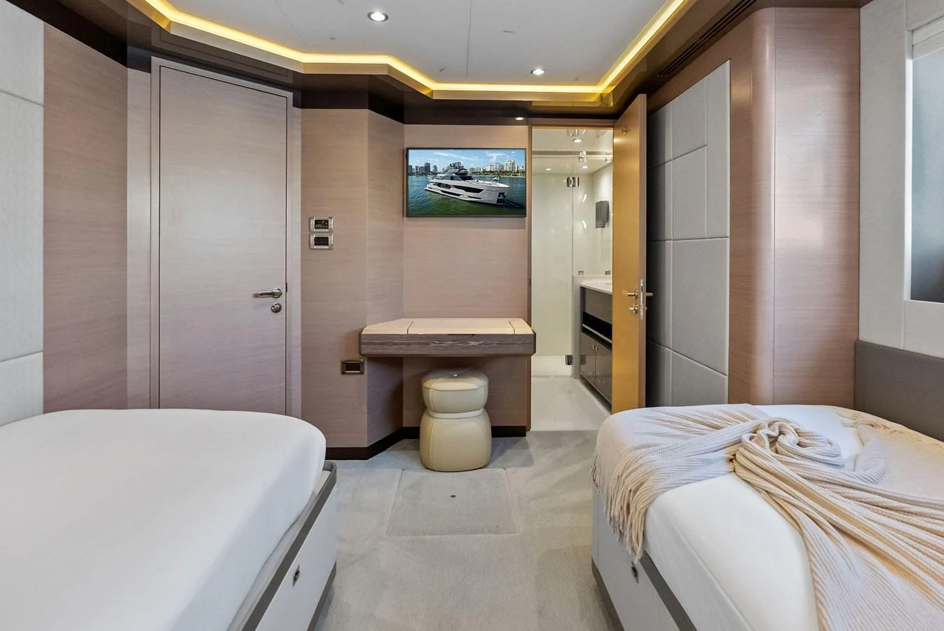 The guest stateroom offers a serene and comfortable retreat with twin beds and modern amenities. aboard SERENITY NOW Yacht for Sale
