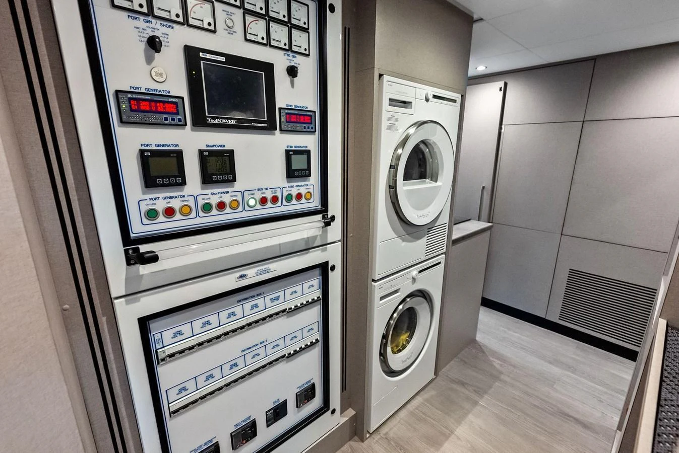 The yacht's laundry room features modern appliances and essential control panels. aboard SERENITY NOW Yacht for Sale