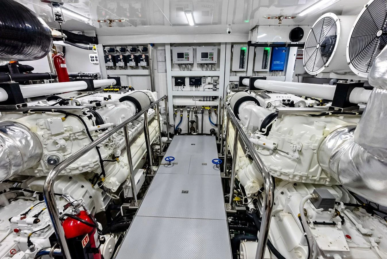 The image showcases a pristine and well-organized engine room with advanced machinery and equipment. aboard SERENITY NOW Yacht for Sale