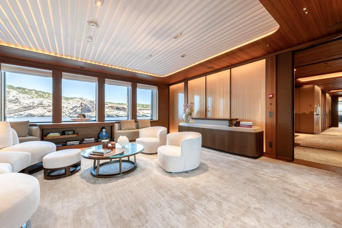 The salon features luxurious seating with panoramic windows offering stunning views. aboard KENSHO Yacht for Sale