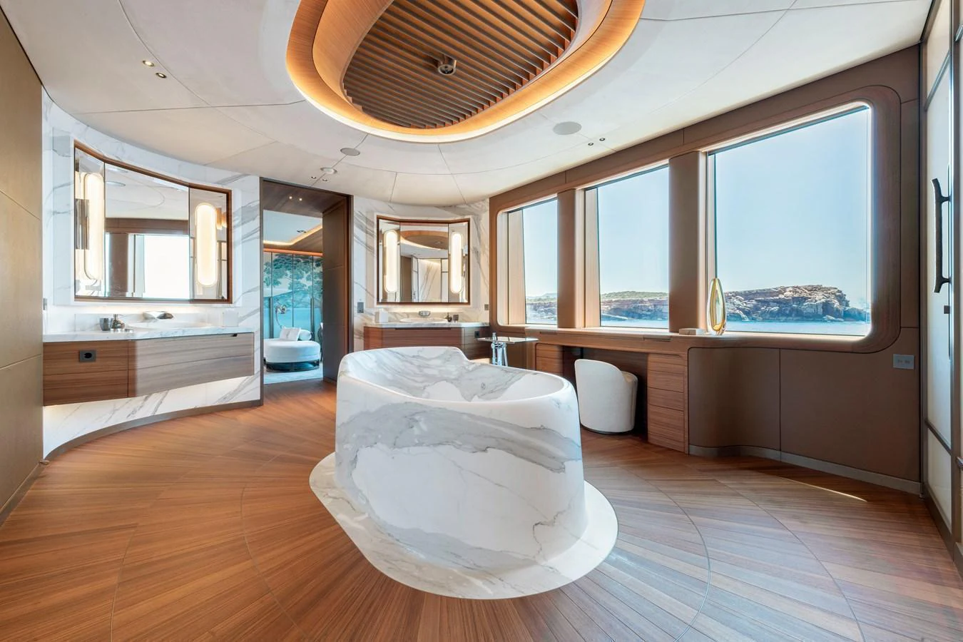 The yacht's bathroom features a luxurious design with large windows offering stunning sea views. aboard KENSHO Yacht for Sale