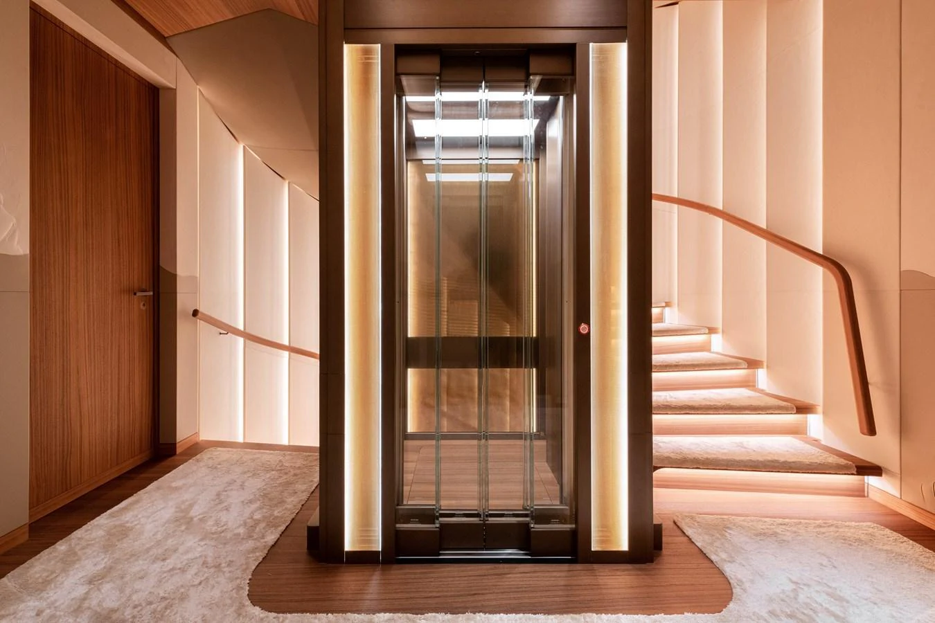 The yacht's interior features a luxurious elevator with elegant lighting and a modern design. aboard KENSHO Yacht for Sale