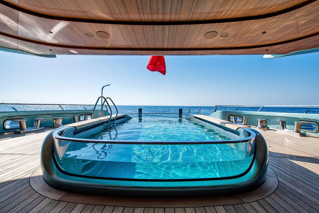 The yacht features a stunning pool deck with a clear view of the ocean. aboard KENSHO Yacht for Sale