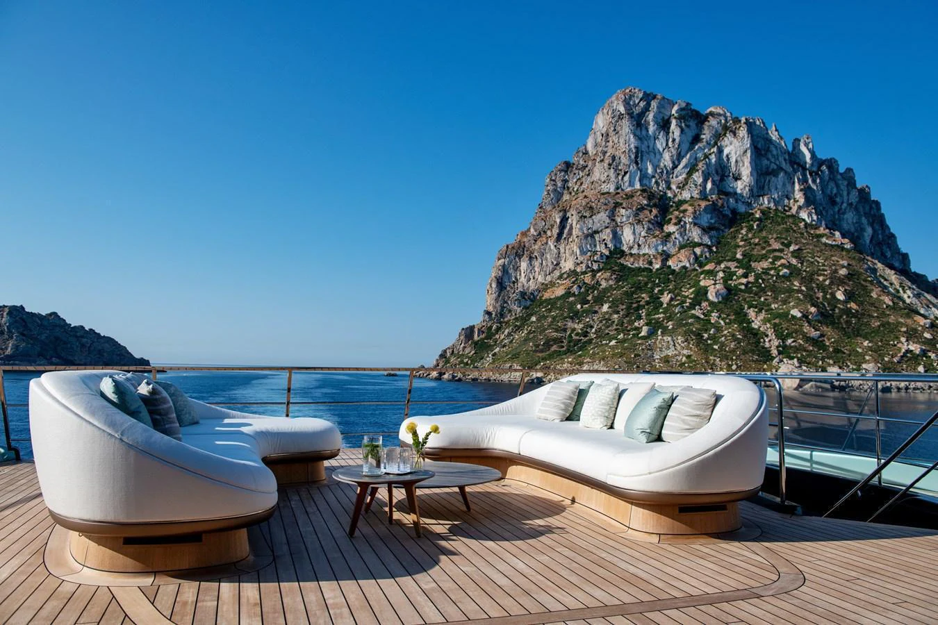 The aft deck features luxurious seating with stunning views of the surrounding landscape. aboard KENSHO Yacht for Sale