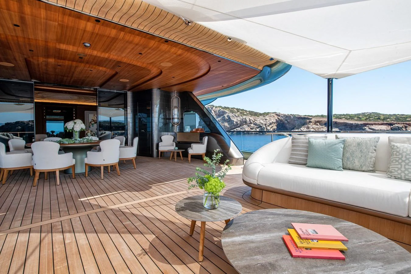 The aft deck offers a spacious and elegant outdoor living area with comfortable seating and stunning views. aboard KENSHO Yacht for Sale
