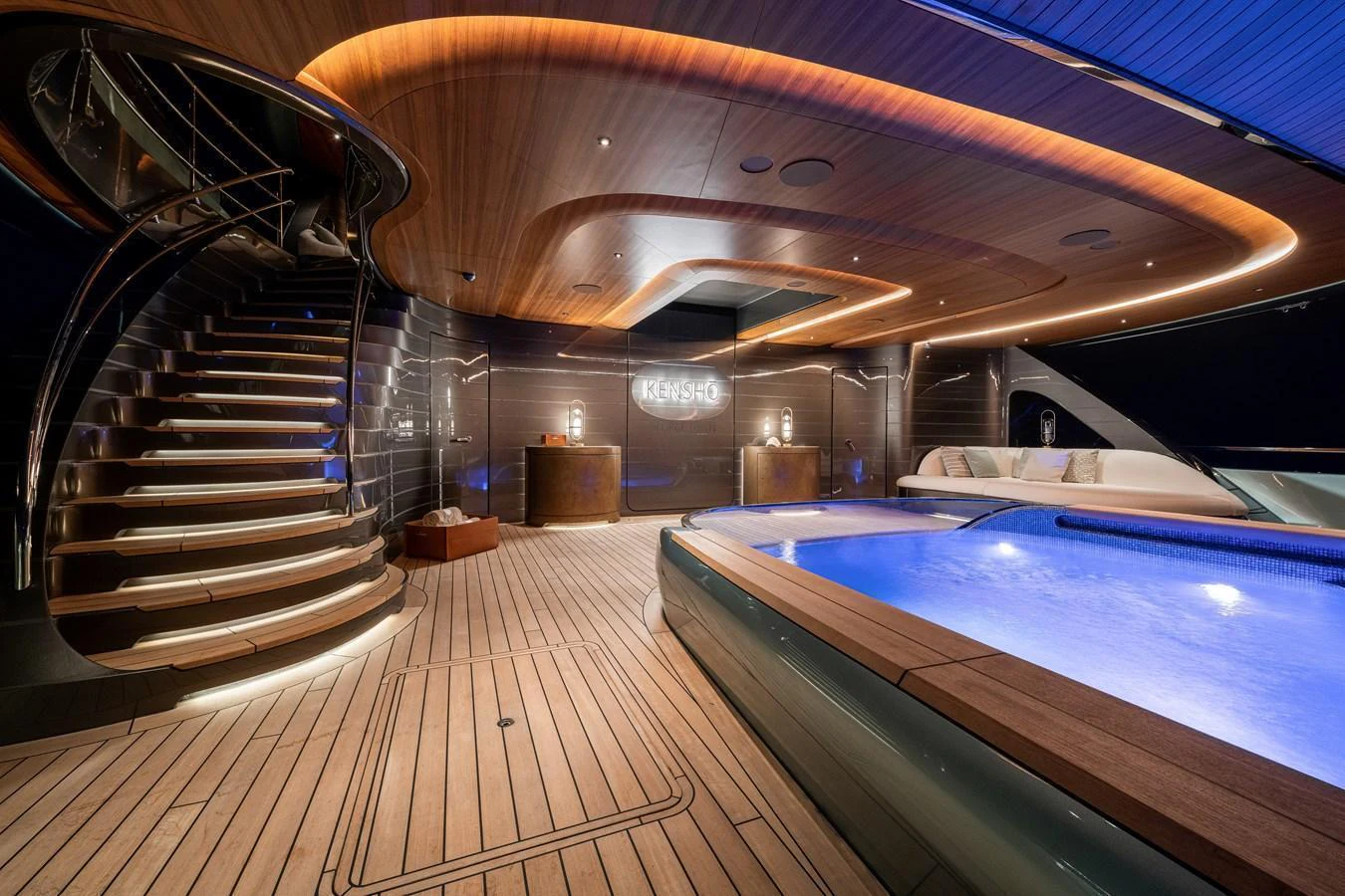 The sundeck features a luxurious hot tub and elegant seating area, perfect for relaxation and entertainment. aboard KENSHO Yacht for Sale