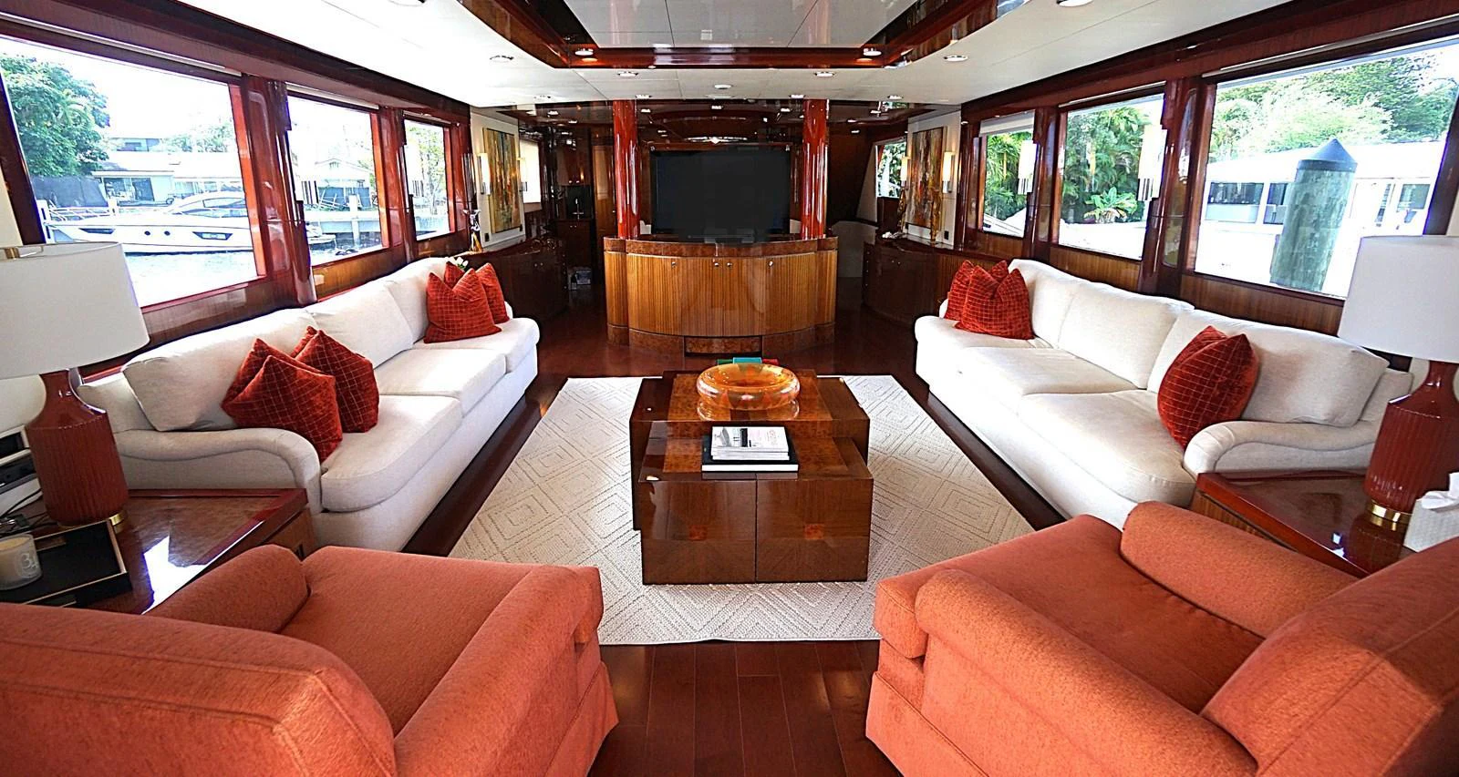 The salon features plush seating, a large television, and elegant wood finishes, creating a luxurious and inviting atmosphere. aboard ROBIN'S NEST Yacht for Sale
