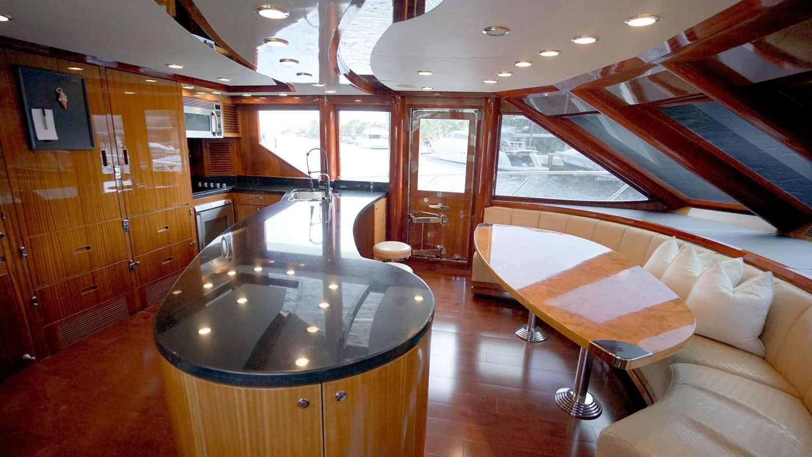 The galley features sleek wood finishes and modern appliances, creating a luxurious and functional space. aboard ROBIN'S NEST Yacht for Sale