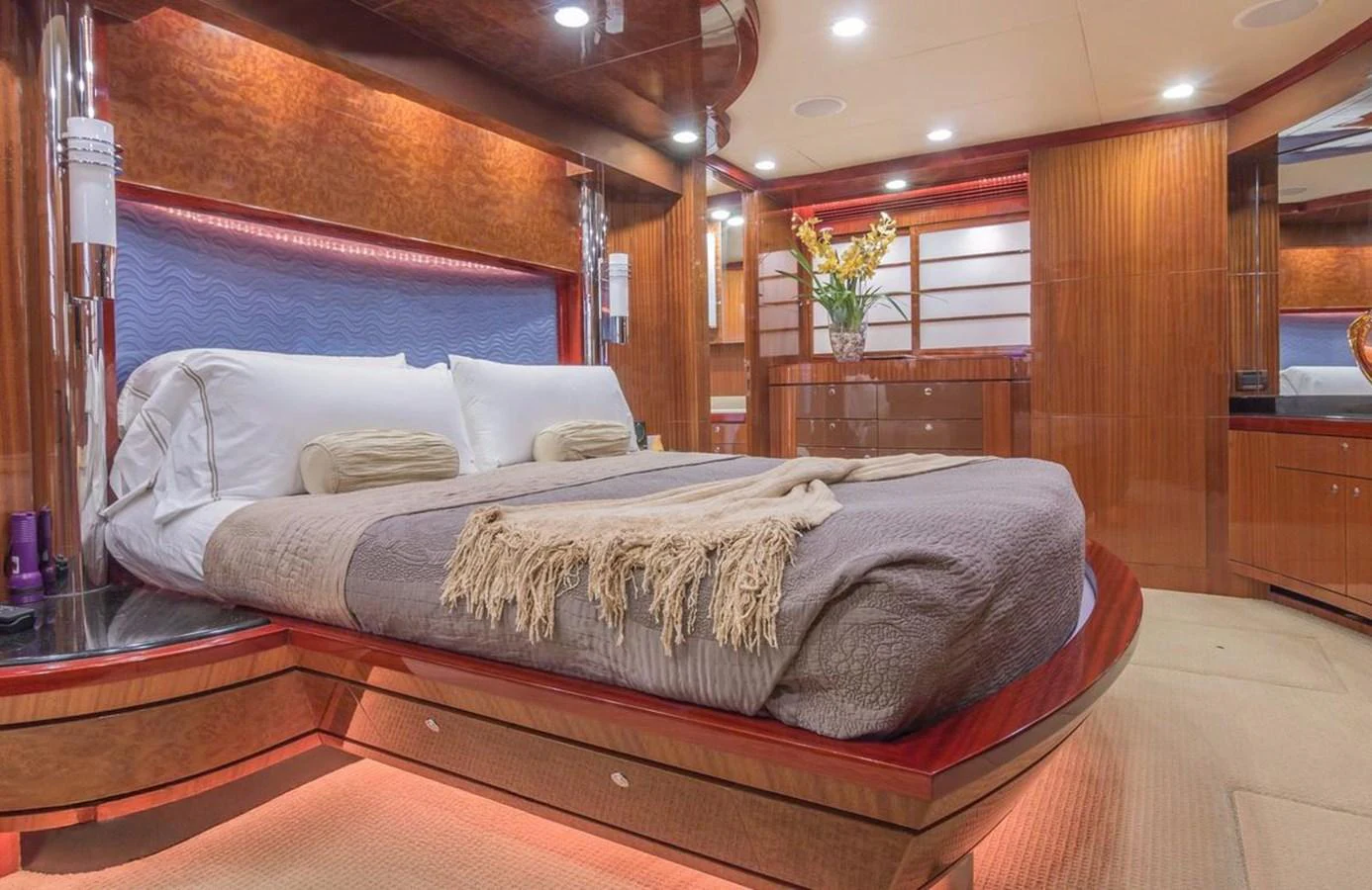The master stateroom features luxurious wood finishes and a spacious, comfortable bed. aboard ROBIN'S NEST Yacht for Sale
