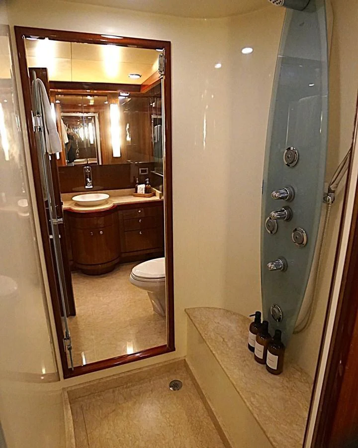 A luxurious yacht bathroom featuring a modern shower and elegant fixtures. aboard ROBIN'S NEST Yacht for Sale