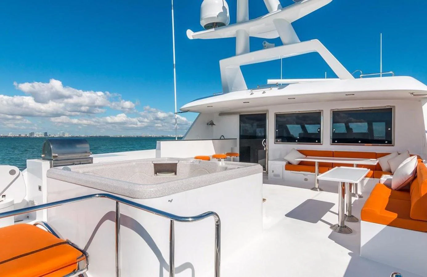 The aft deck offers a spacious and inviting area with comfortable seating and a stunning view of the sea. aboard ROBIN'S NEST Yacht for Sale