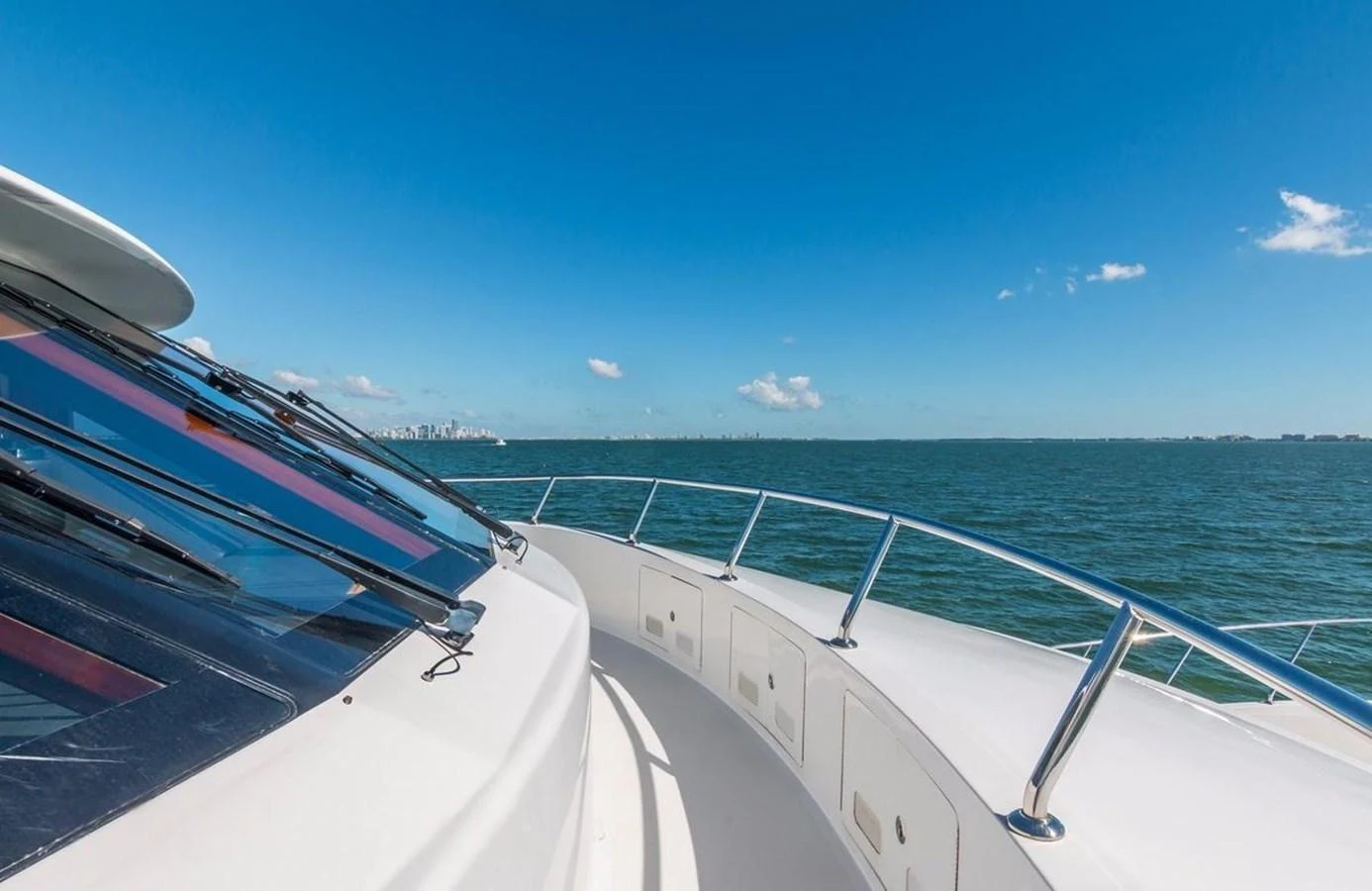 The yacht's bow offers a stunning view of the open sea under a clear blue sky. aboard ROBIN'S NEST Yacht for Sale