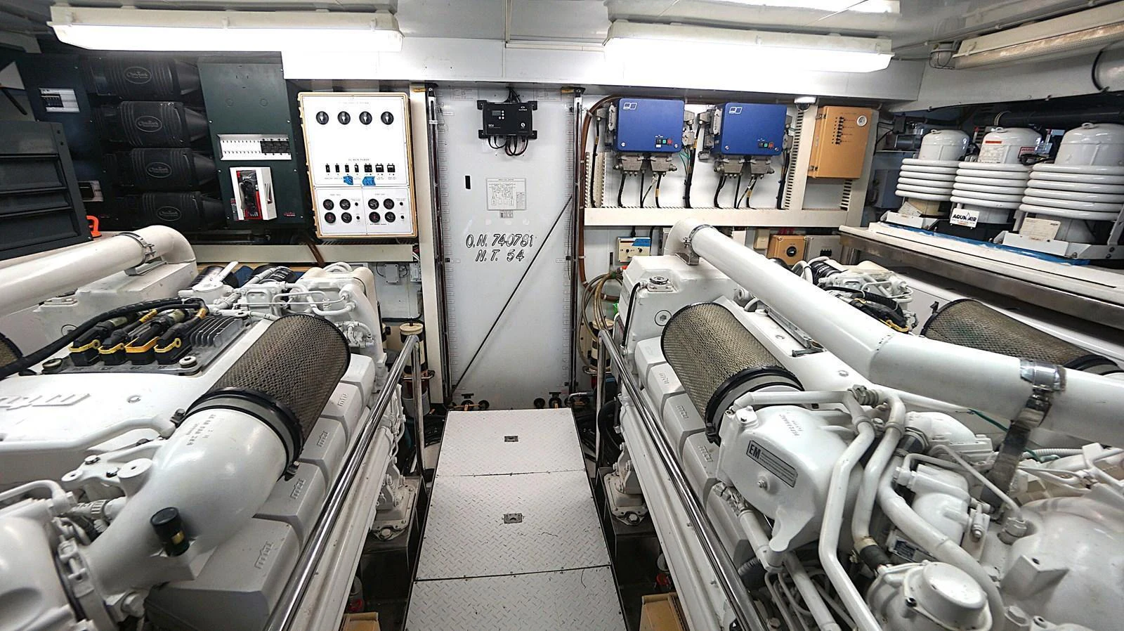 The image shows a well-maintained engine room with advanced machinery and equipment. aboard ROBIN'S NEST Yacht for Sale