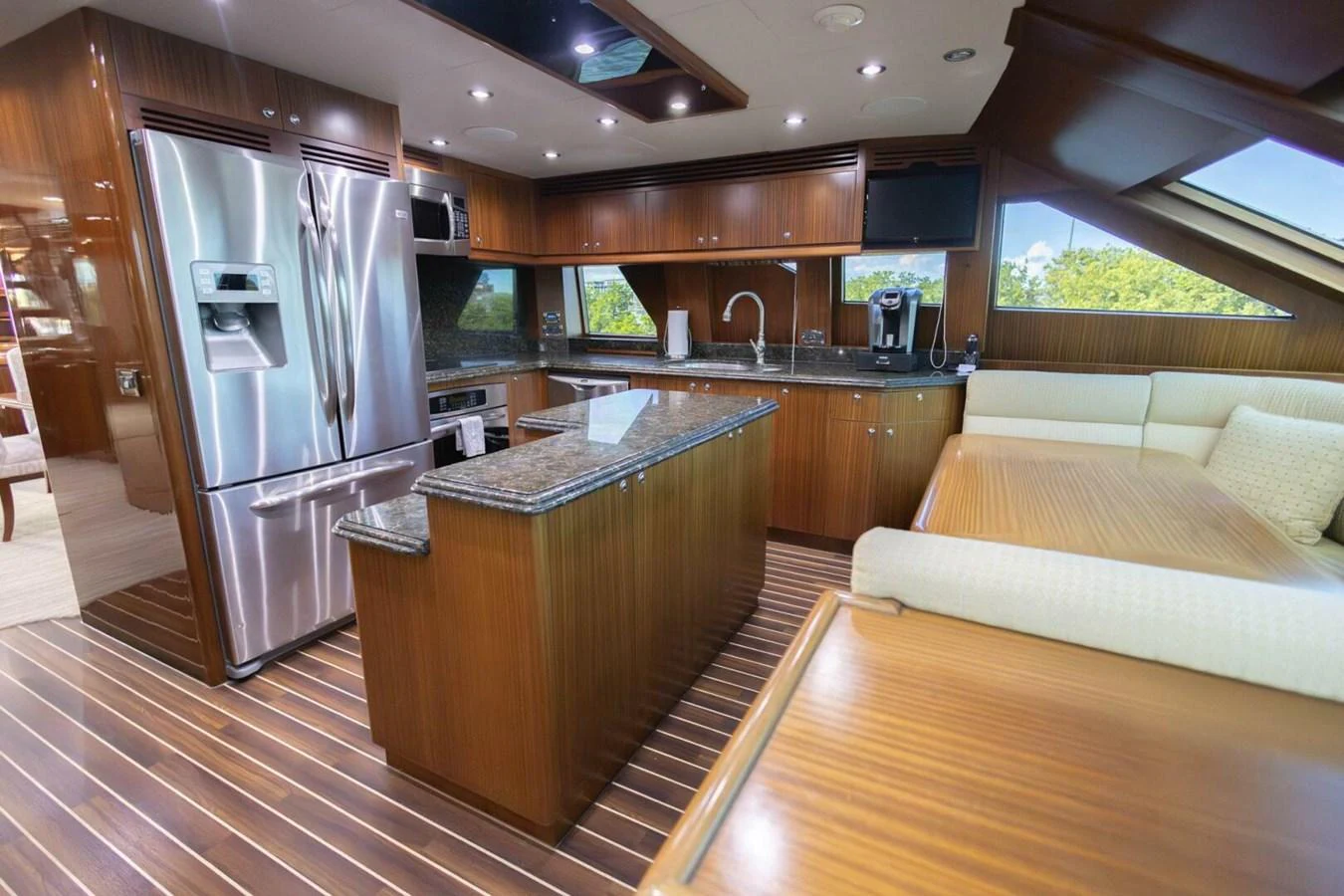 The galley features modern appliances, rich wood cabinetry, and ample counter space. aboard BOBBI TOO Yacht for Sale