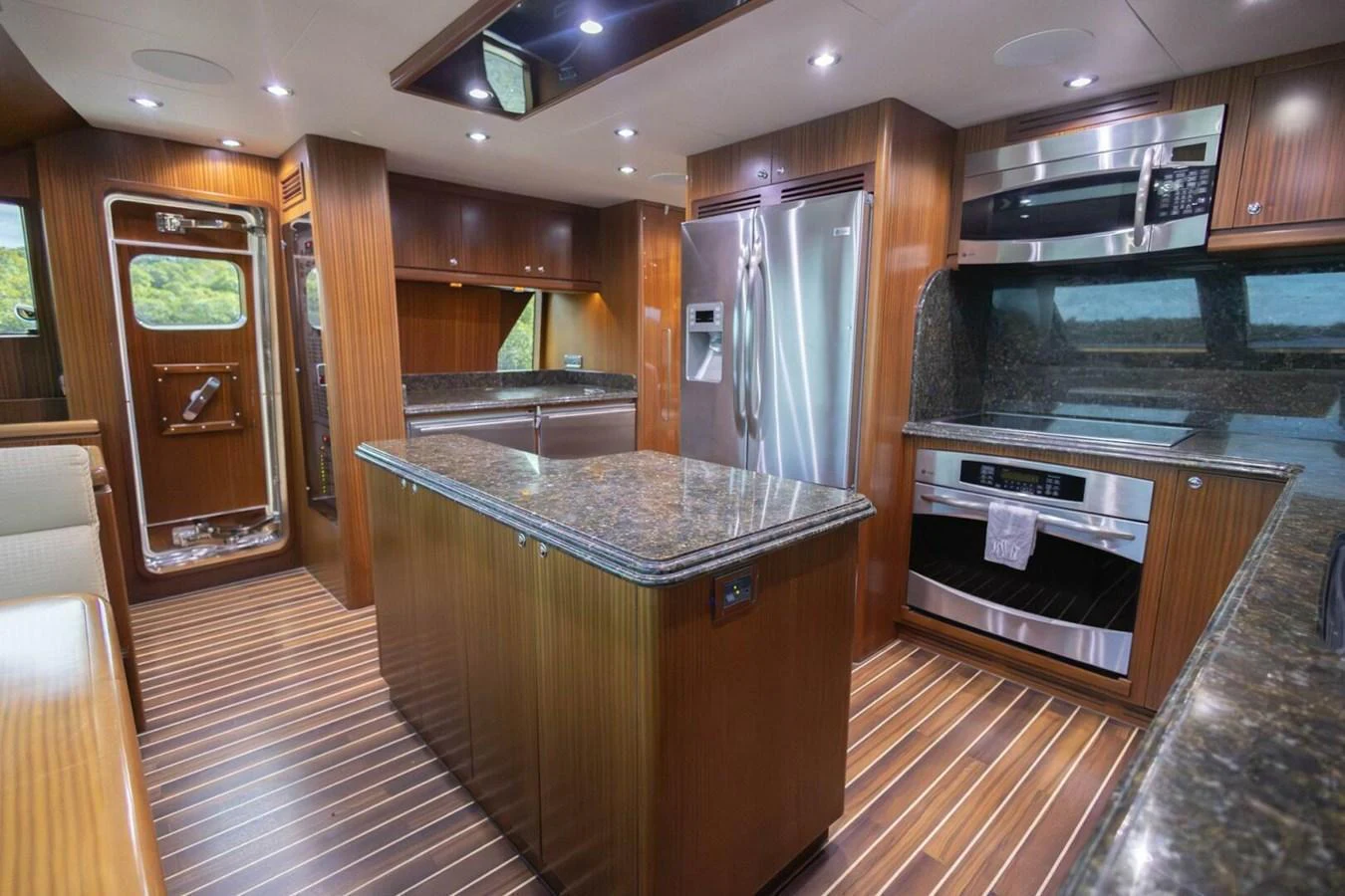 The galley features modern appliances, rich wood finishes, and ample counter space. aboard BOBBI TOO Yacht for Sale