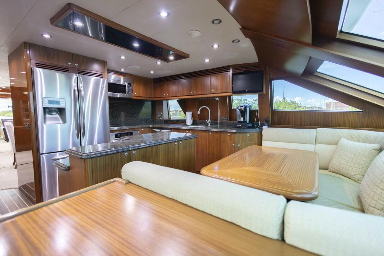 The yacht's galley features modern appliances and a cozy dining area with ample natural light. aboard BOBBI TOO Yacht for Sale