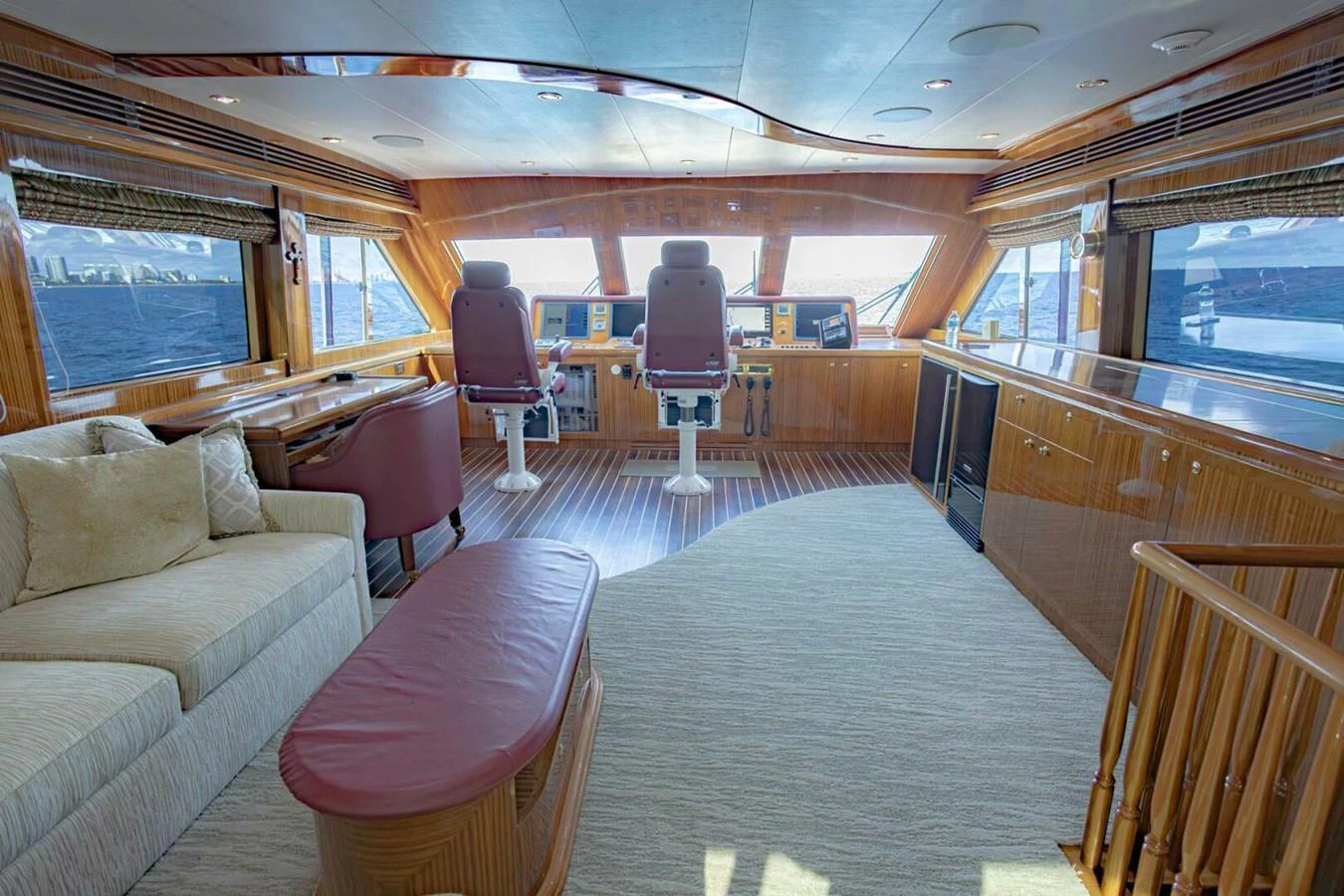 The helm station features luxurious seating and expansive windows for a commanding view. aboard BOBBI TOO Yacht for Sale