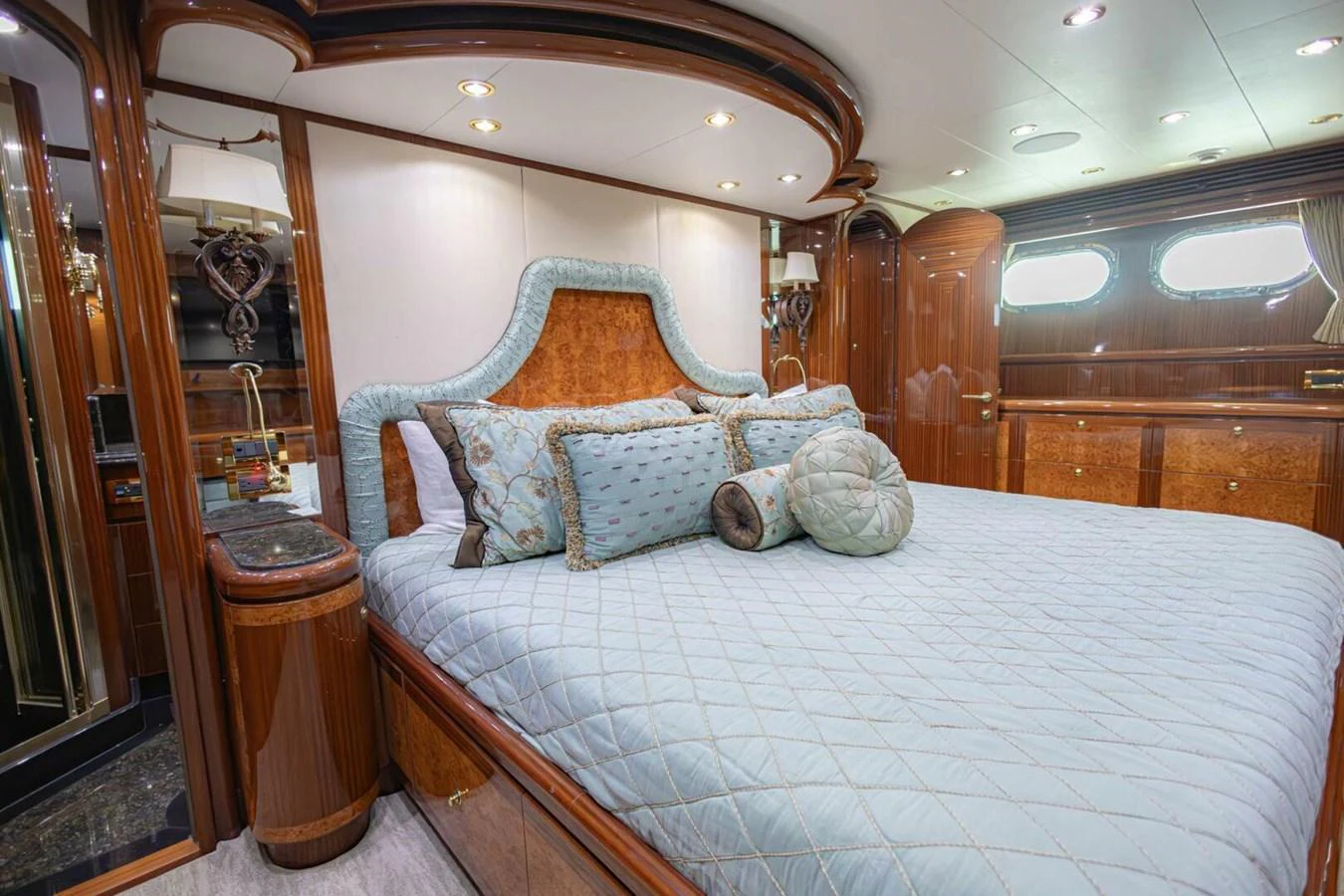 The master stateroom features luxurious bedding and elegant wood finishes, creating a serene and opulent retreat. aboard BOBBI TOO Yacht for Sale
