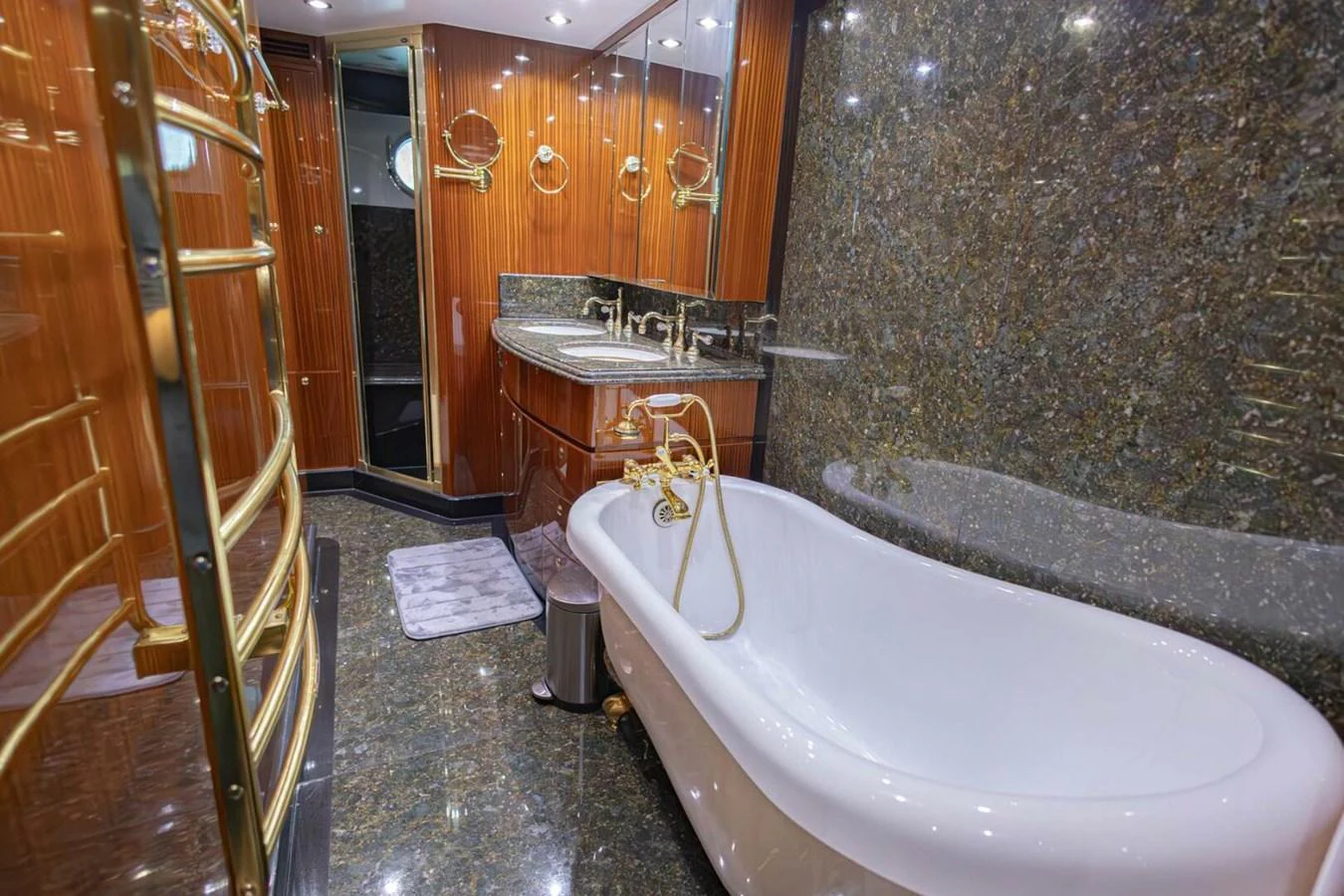 The yacht's bathroom features luxurious finishes with a freestanding bathtub and elegant fixtures. aboard BOBBI TOO Yacht for Sale