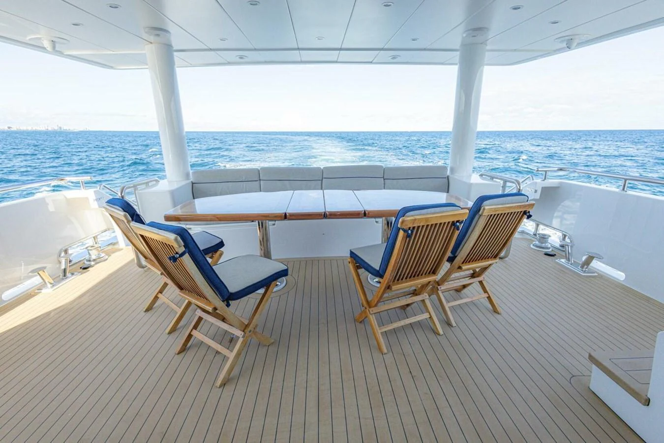 The aft deck features comfortable seating with a stunning view of the open sea. aboard BOBBI TOO Yacht for Sale