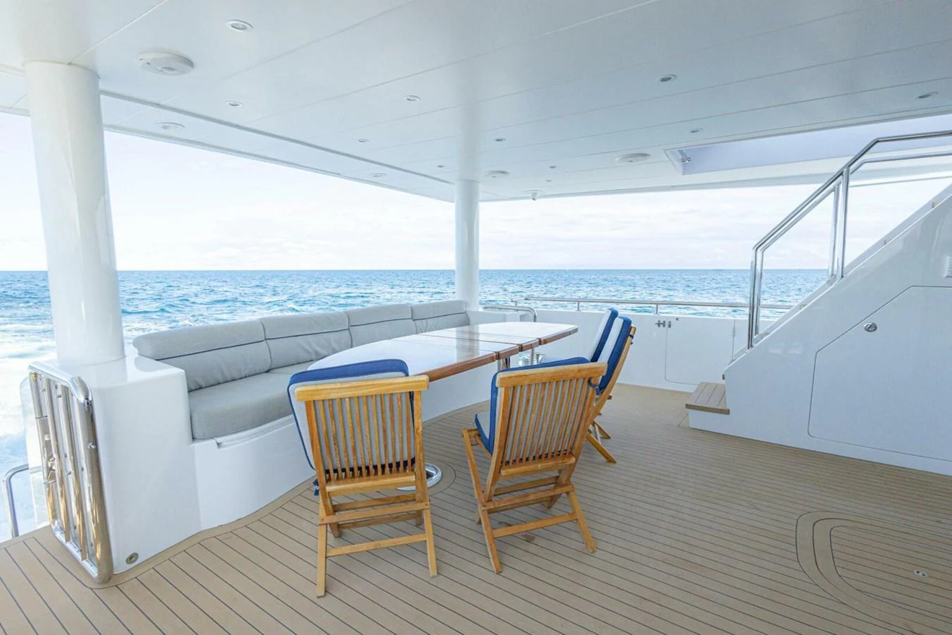 The aft deck offers a serene seating area with a stunning ocean view. aboard BOBBI TOO Yacht for Sale
