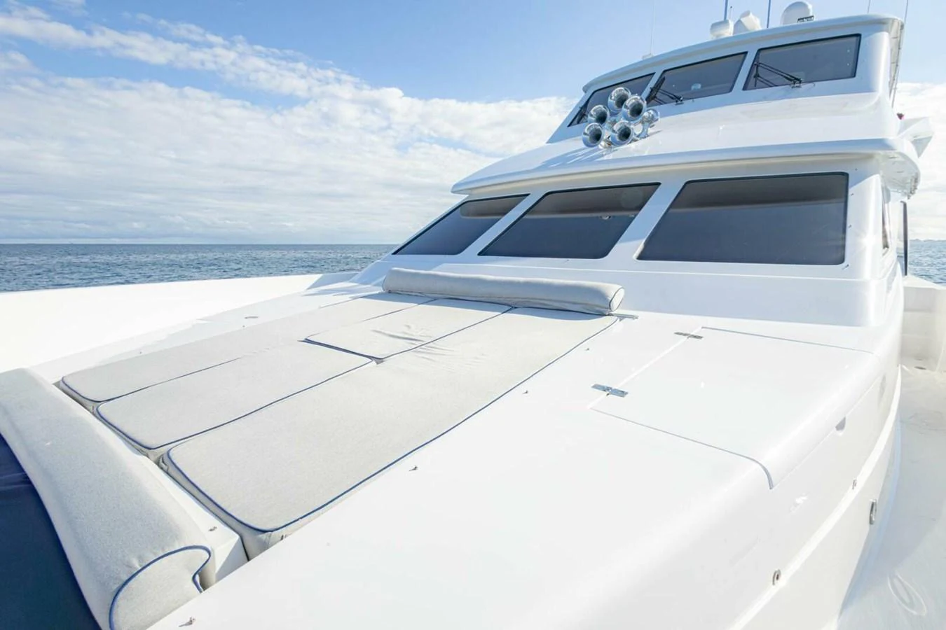 The yacht's sleek exterior features a spacious sunbathing area on the foredeck, perfect for relaxation under the sun. aboard BOBBI TOO Yacht for Sale