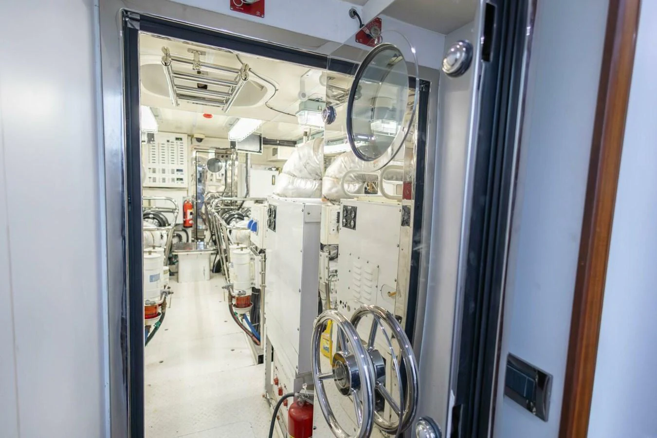 The image showcases the yacht's well-maintained engine room with advanced machinery and equipment. aboard BOBBI TOO Yacht for Sale