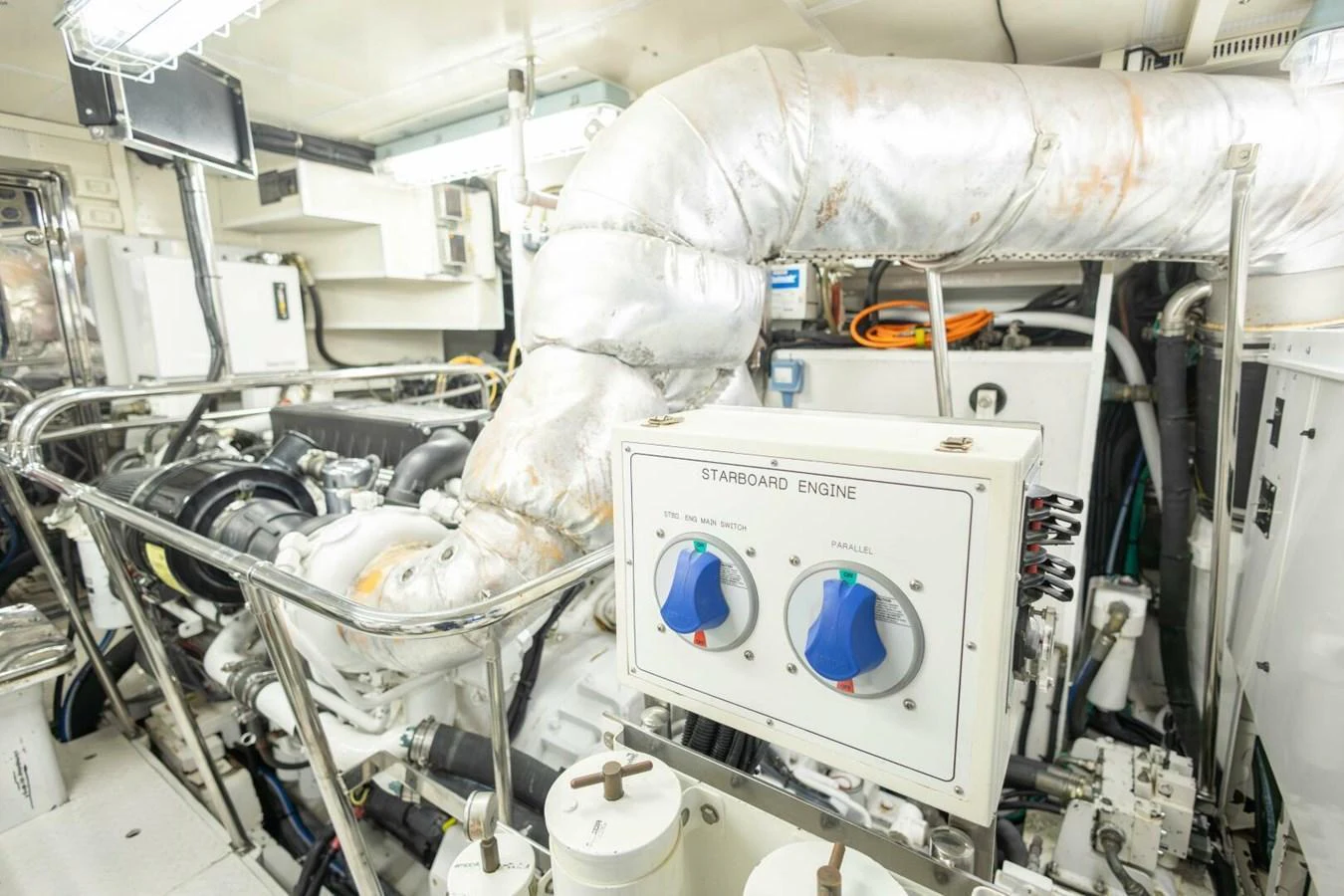 The image showcases the yacht's engine room with detailed machinery and control panels. aboard BOBBI TOO Yacht for Sale