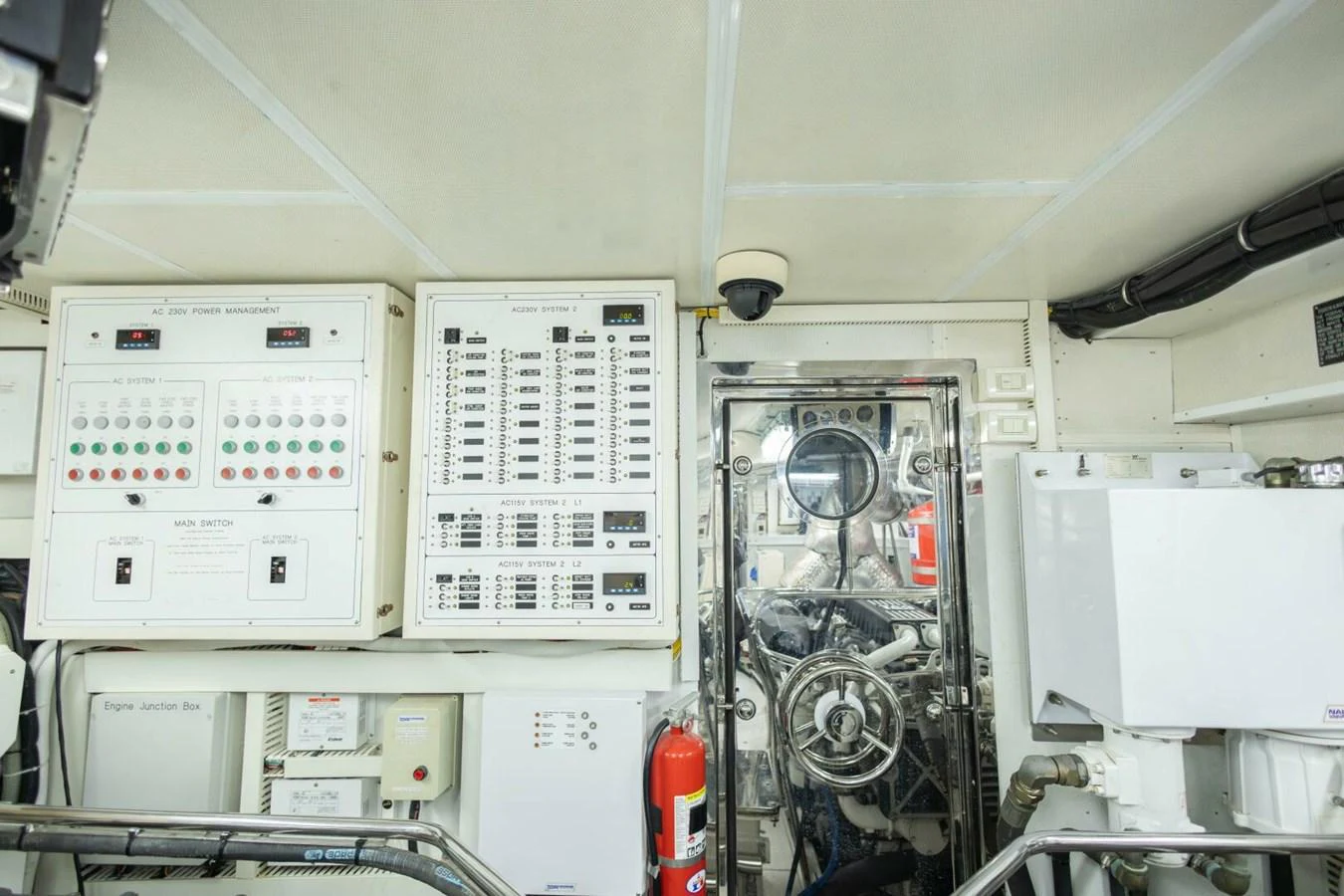 The image showcases the yacht's well-organized engine room with control panels and machinery. aboard BOBBI TOO Yacht for Sale