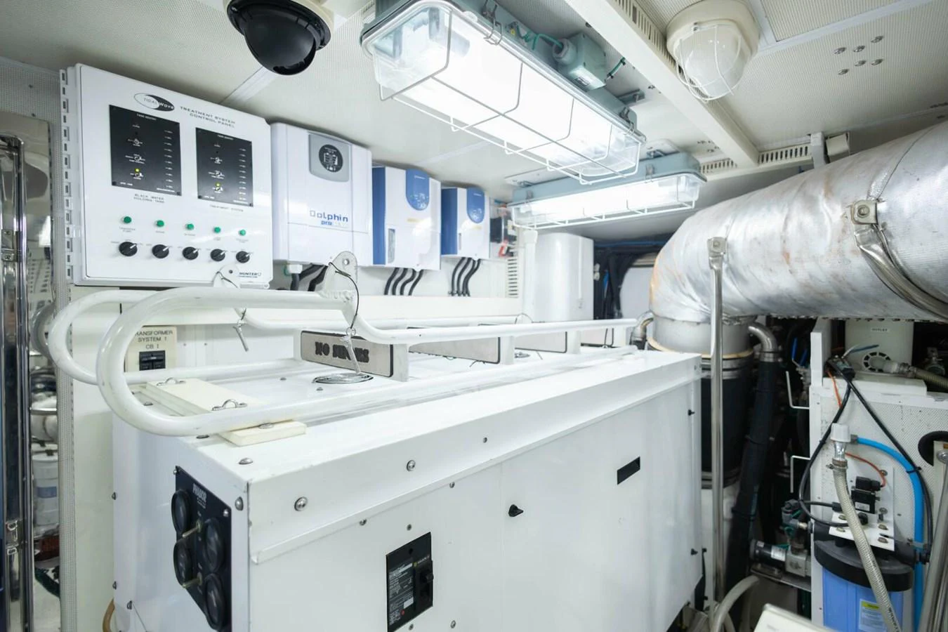 The image showcases the yacht's well-maintained engine room with advanced machinery and control panels. aboard BOBBI TOO Yacht for Sale
