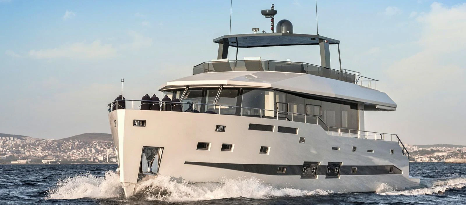 a large white boat in the water aboard ATLASS Yacht for Sale