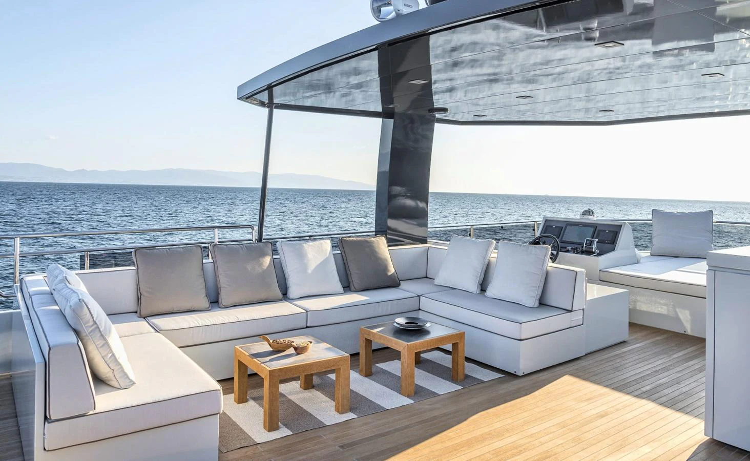a living room with a large balcony aboard ATLASS Yacht for Sale