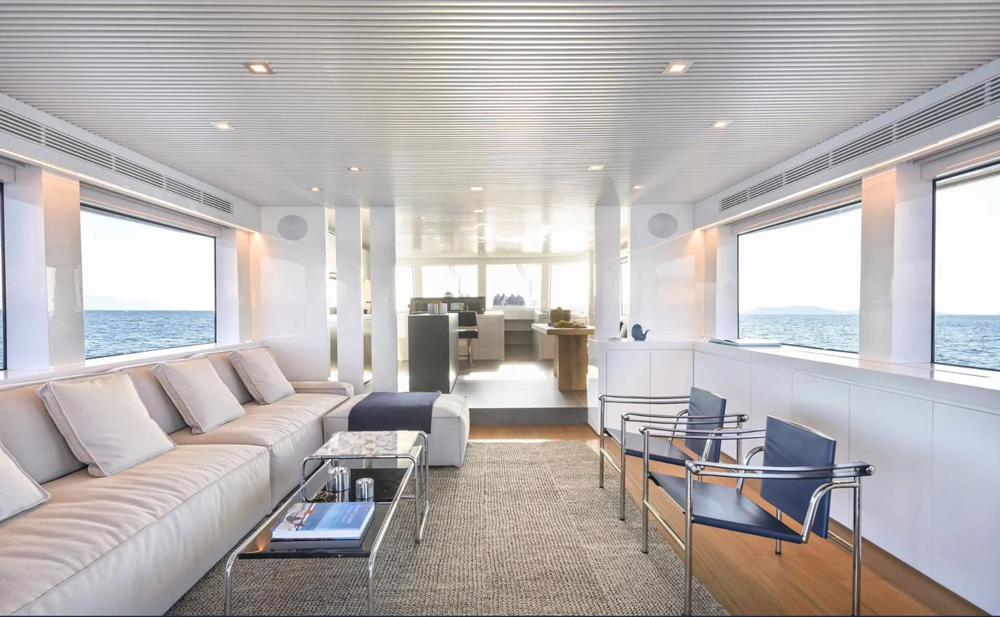 a living room with a couch and a table aboard ATLASS Yacht for Sale
