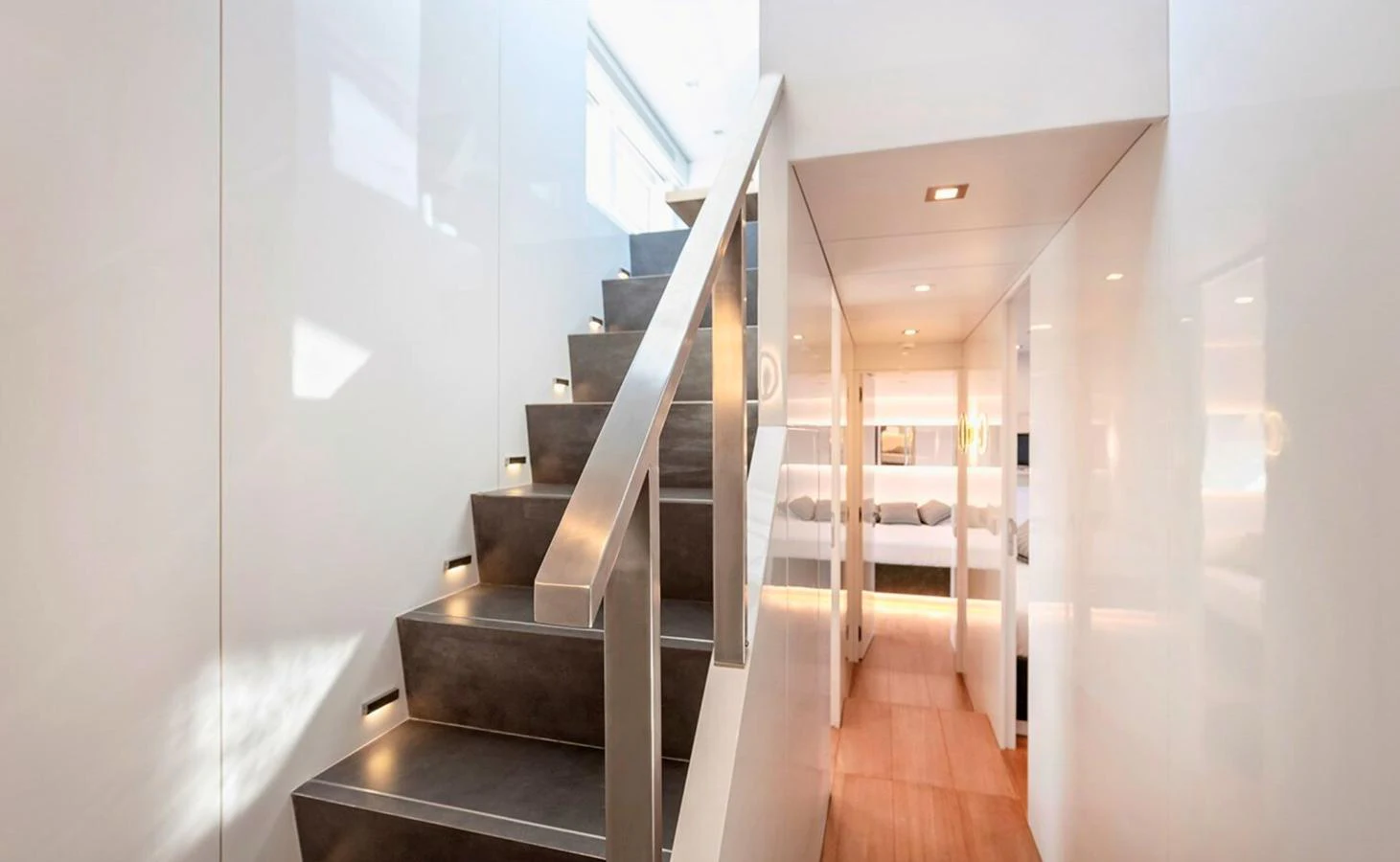 a long hallway with white walls aboard ATLASS Yacht for Sale