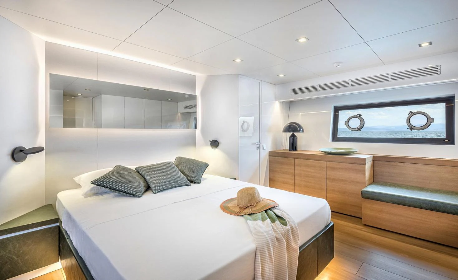 a room with a bed and a television aboard ATLASS Yacht for Sale