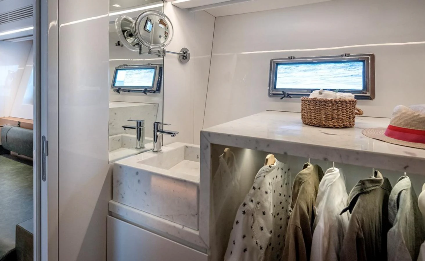a bathroom with a sink and a television aboard ATLASS Yacht for Sale